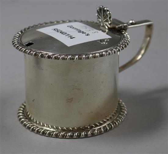 A late Victorian silver drum shaped mustard pot.